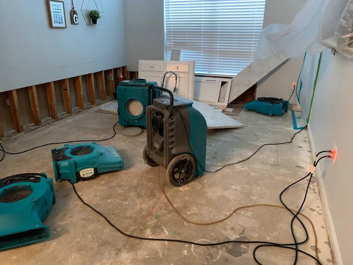 Dehumidifier in flood-cut room for Water Damage Restoration in Greensboro